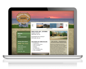Computer with ManitouShores.com website on screen.